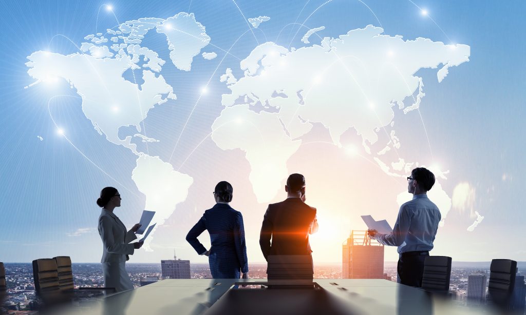 Silhouettes of business people working in cooperation. Mixed media, international business