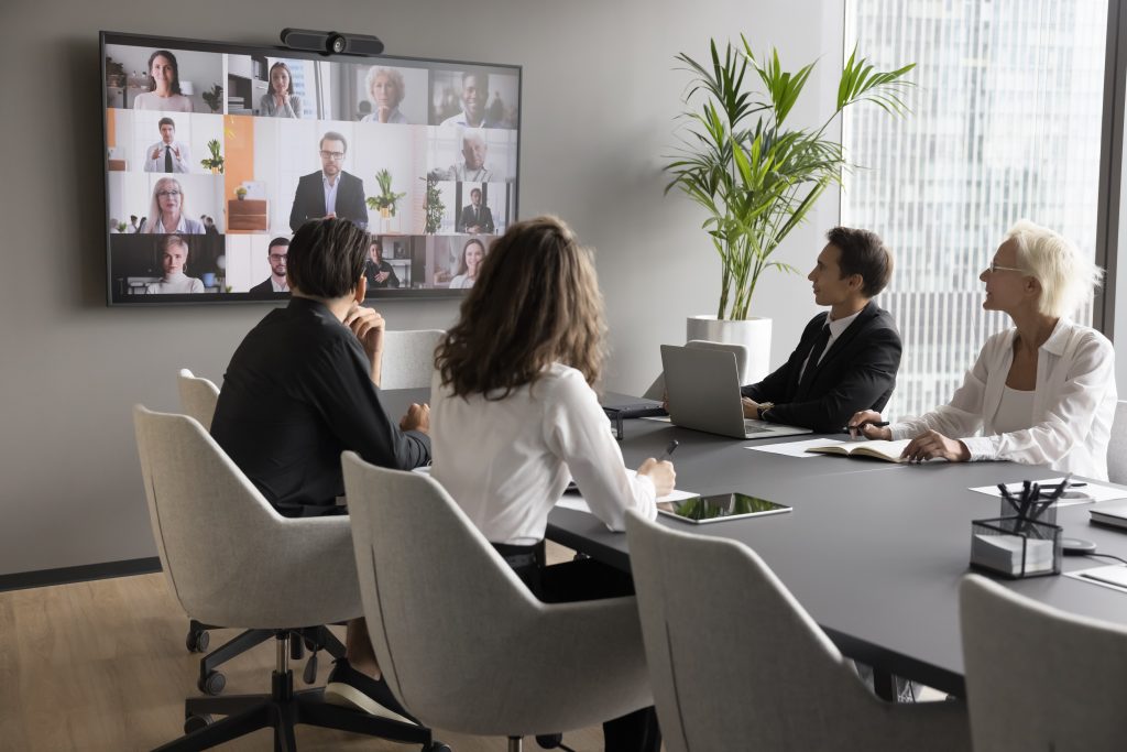 Worldwide communication by business using video conference application. Staff members engaged in virtual meeting event with partners, investors or international colleagues. Discussing an international business credit report