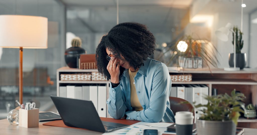 Tired, business and woman with eye strain in office for accounting, work pressure and burnout. Person, laptop and glasses for vertigo risk, employee fatigue and brain fog tension of financial mistake.